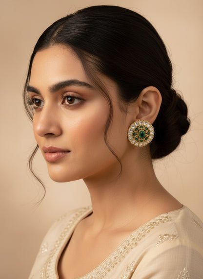 SHE BEAUTY Kundan tops featuring a round gold-tone design with a central green stone and white accents on a model