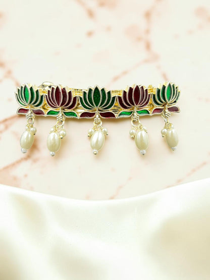 SHE BEAUTY lotus meenakari barrette featuring green and maroon enamel petals with dangling cream pearl accents.
