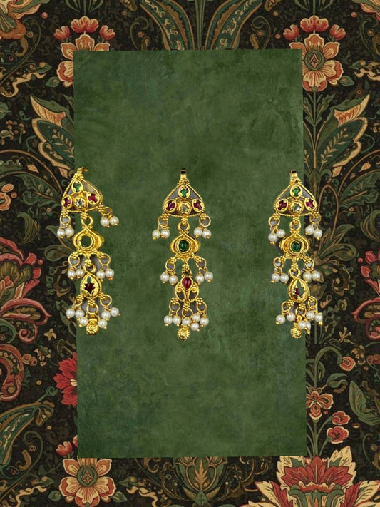 SHE BEAUTY set of three matt gold brooches featuring intricate traditional designs with red, green, and pearl accents.