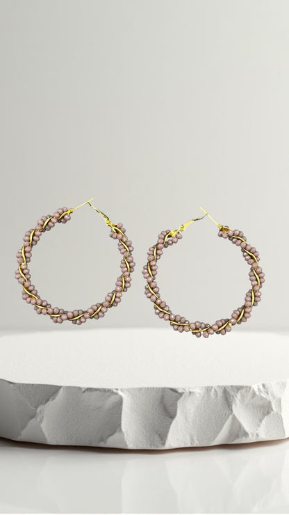 SHE BEAUTY Girlish Crystal Bali hoop earrings featuring mauve beaded wire wrapped around a gold-tone metal frame.