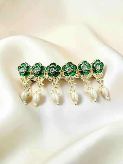 SHE BEAUTY AD Rose Meenakari pearl barrette featuring green floral enamel, crystal accents, and dangling pearl drops.
