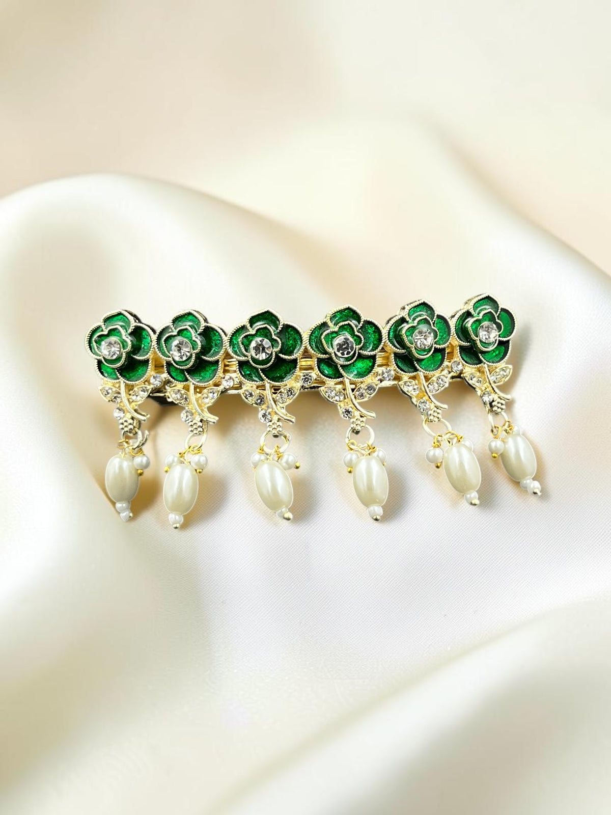 SHE BEAUTY AD Rose Meenakari pearl barrette featuring green floral enamel, crystal accents, and dangling pearl drops.