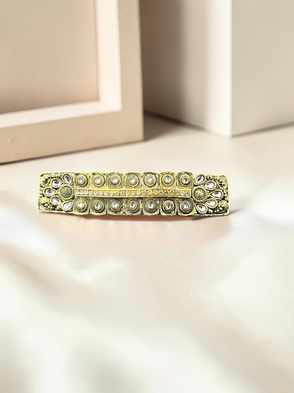 SHE BEAUTY boho vintage metallic barrette with intricate engraved patterns and white stone accents for festive wear.