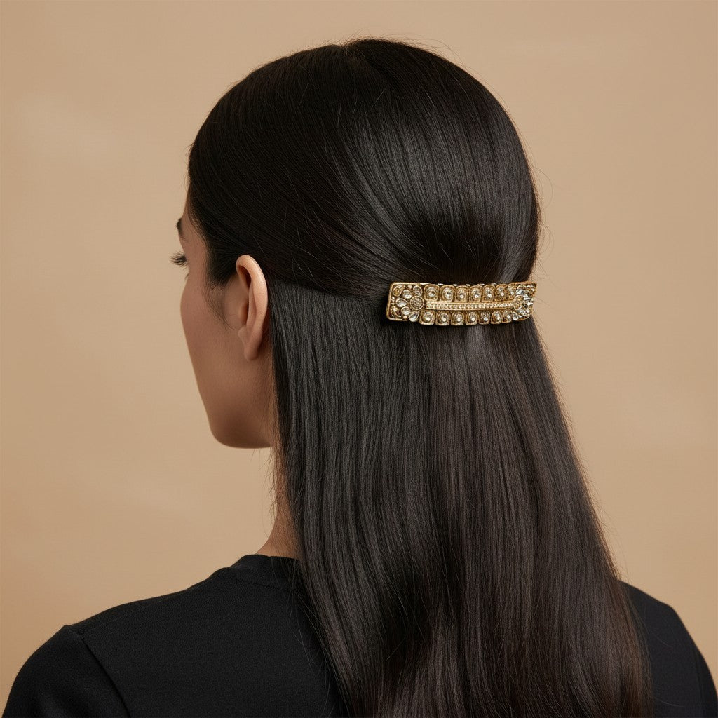 SHE BEAUTY boho vintage metallic barrette with intricate gold detailing worn in dark hair for a festive look