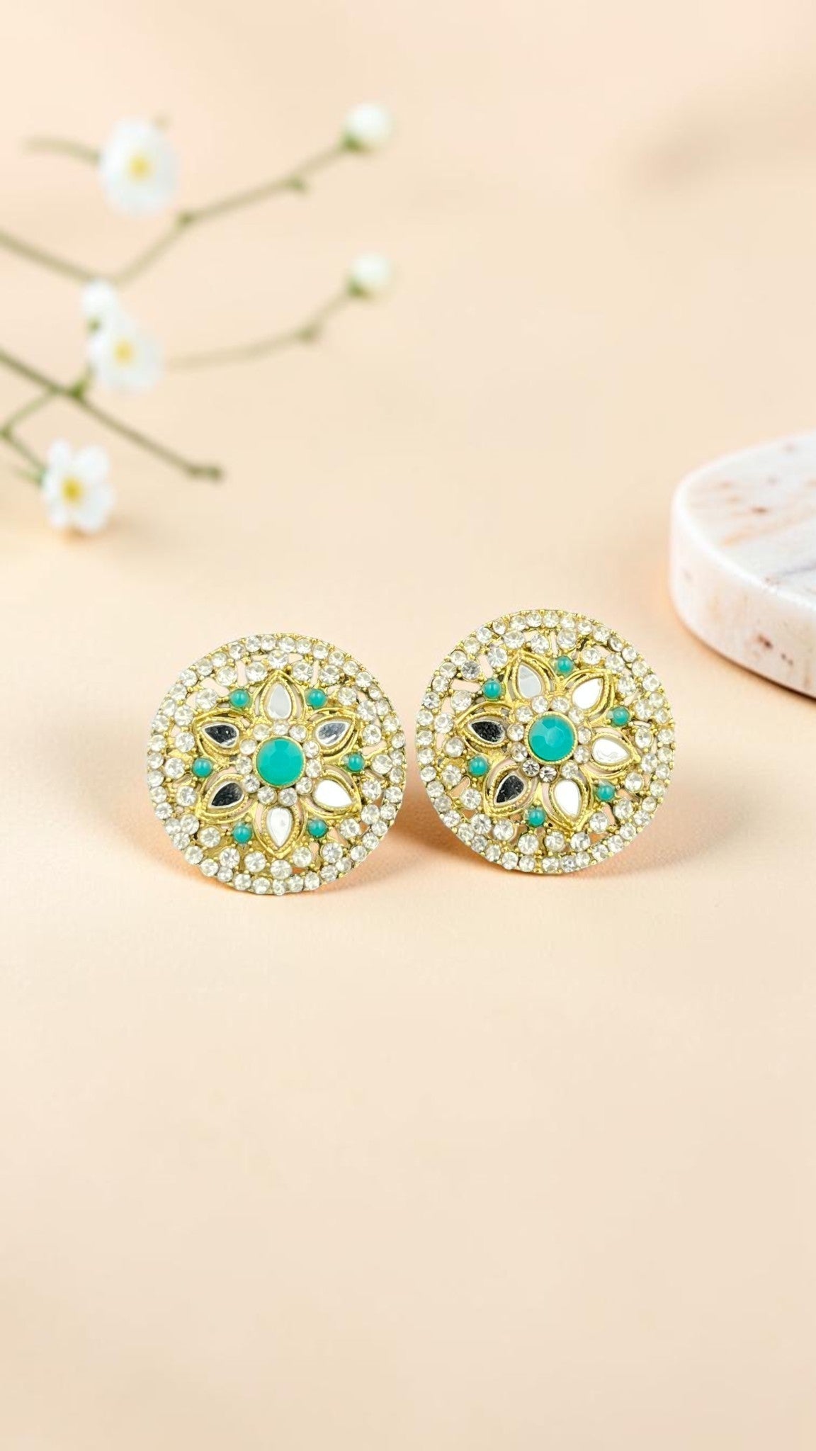 SHE BEAUTY round stud earrings featuring mirror stones, turquoise accents, and gold-tone detailing for festive wear.
