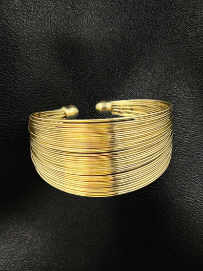 SHE BEAUTY solid multilayer golden cuff bracelet with a polished finish for festive and everyday wear.