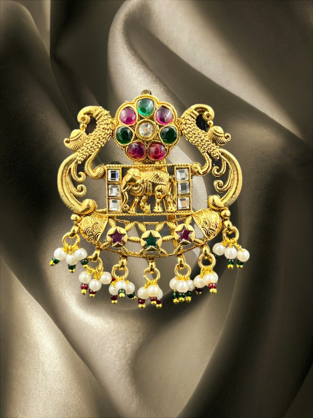 SHE BEAUTY royal peacock hair brooch with ruby and emerald stones, gold finish, and hanging pearl beads.