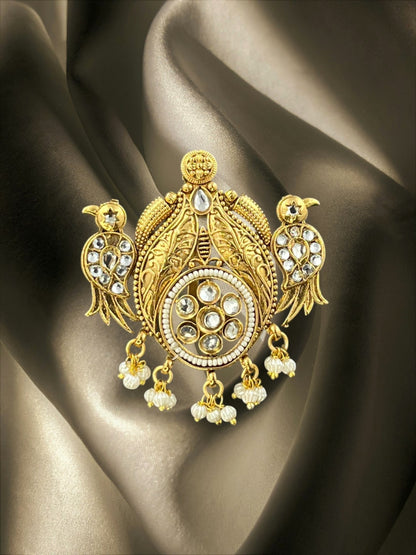 SHE BEAUTY temple peacock juda hair brooch in gold finish with ruby stones, white crystals, and dangling pearl beads.