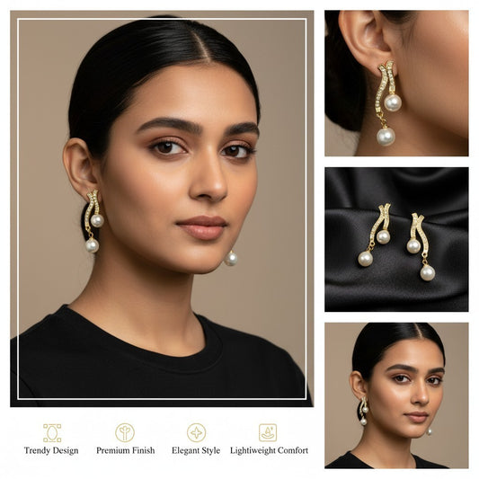 SHE BEAUTY Pearl Drops earrings featuring gold-toned wavy bars with crystal accents and dangling white pearls.