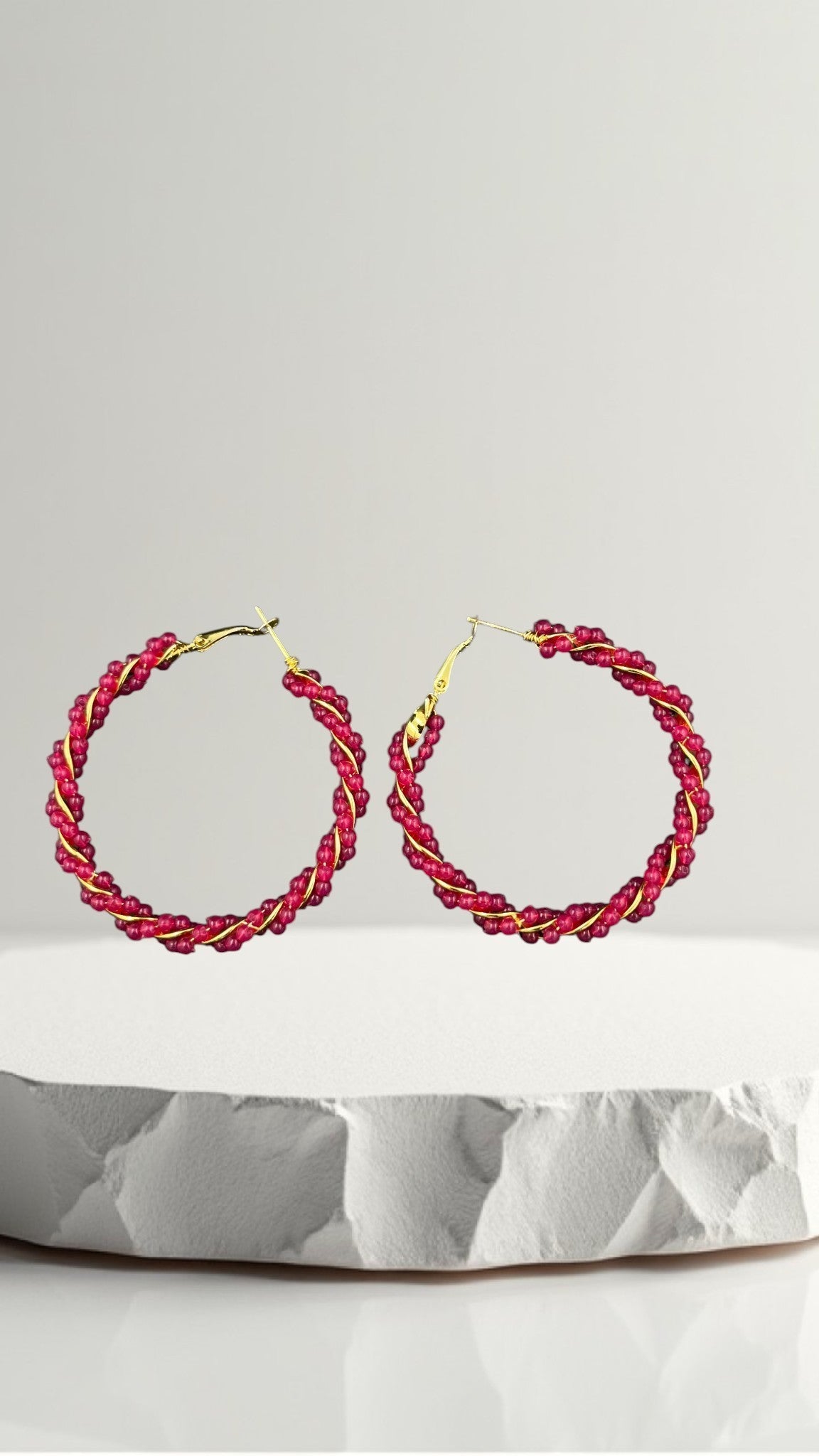SHE BEAUTY Girlish Crystal Bali hoop earrings featuring pink crystal beads wrapped around a gold-tone wire frame.
