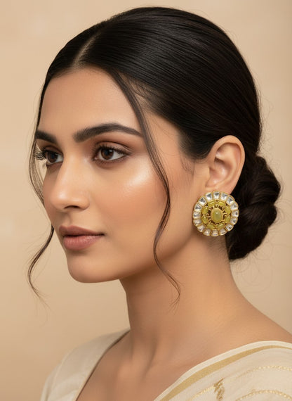 SHE BEAUTY round kundan tops with a central pale green stone and gold finish worn by a woman in a side profile view