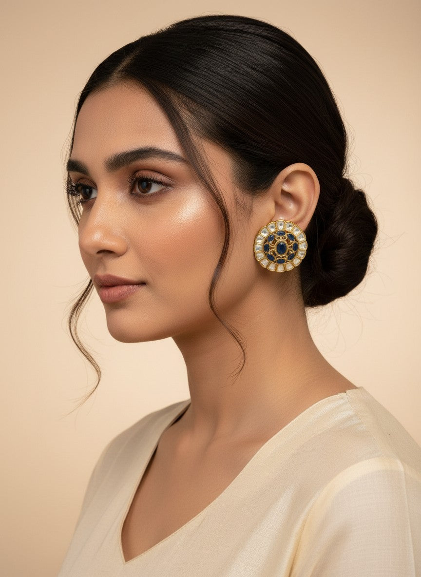 SHE BEAUTY round kundan tops featuring blue stones and gold detailing worn by a woman with a sleek bun hairstyle