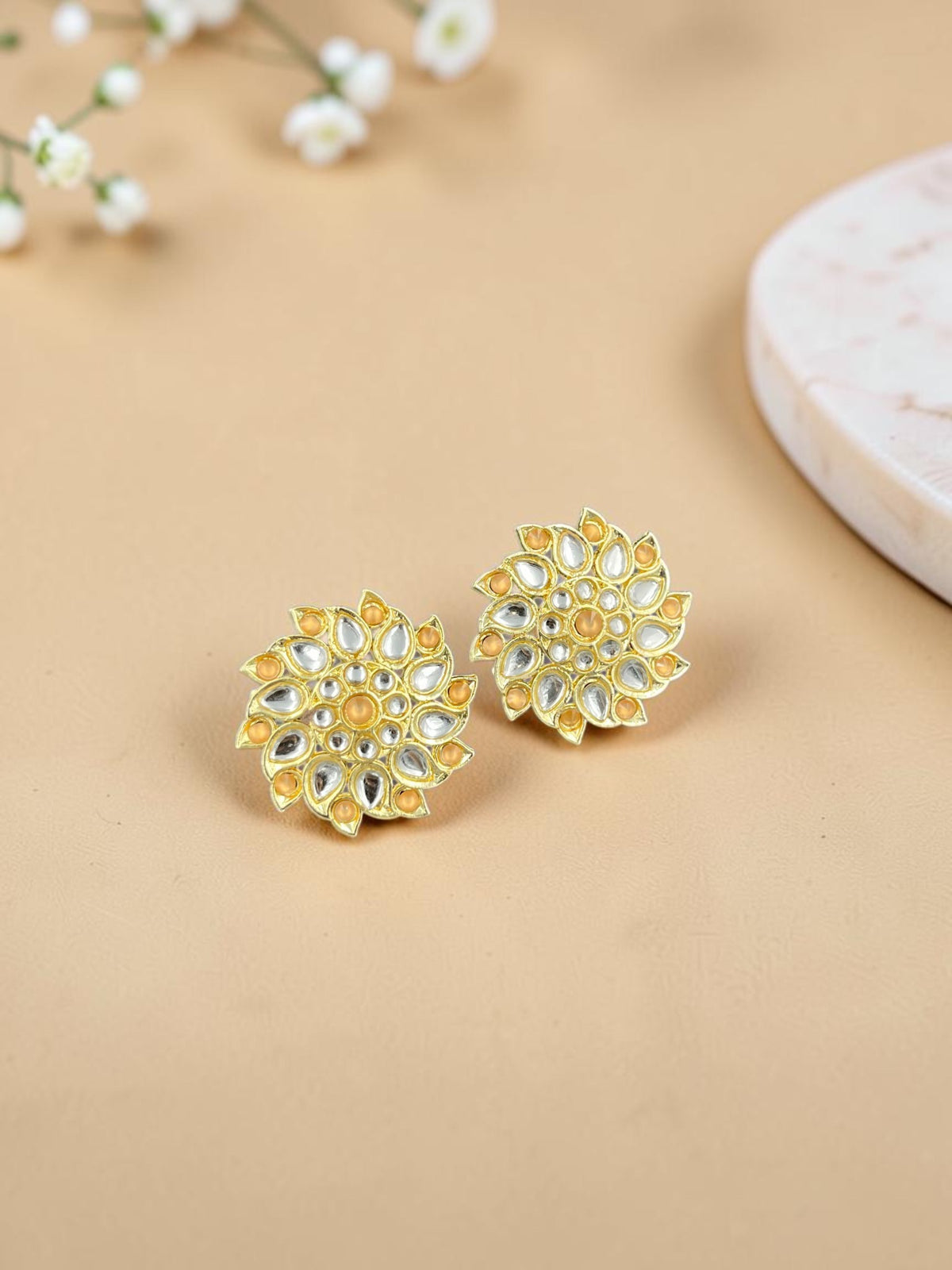 SHE BEAUTY Royal Kundan gold stud earrings with intricate floral-inspired stone detailing for ethnic wear