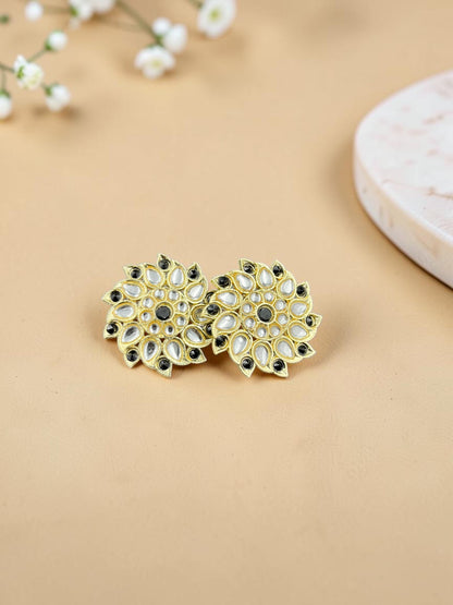 SHE BEAUTY Royal Kundan gold stud earrings with intricate floral design, white stones, and black accents.