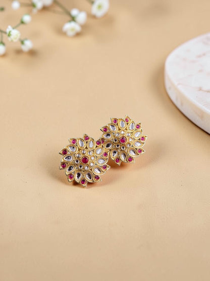 SHE BEAUTY Royal Kundan gold tops featuring a floral design with embedded white stones and central red accents