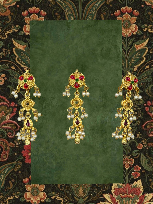 SHE BEAUTY set of 3 gold-toned ruby Kundan choti hair accessories with pearl accents on a floral patterned background