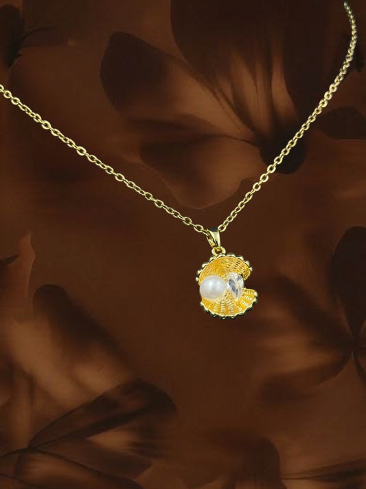 SHE BEAUTY gold-toned seashell pendant necklace featuring a white pearl and sparkling crystal accent