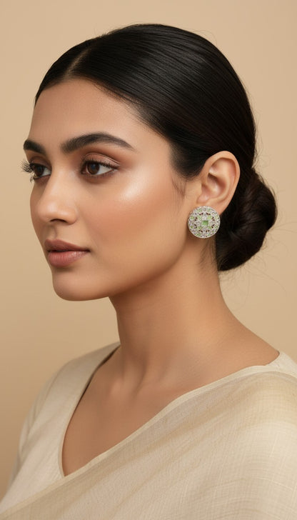 SHE BEAUTY silver AD tops featuring a round intricate design with a central green stone worn by a woman