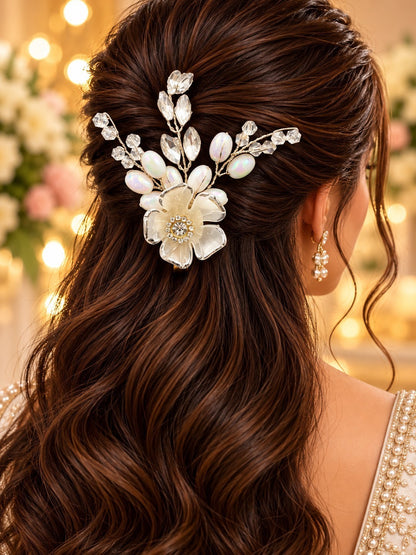 SHE BEAUTY silver blossom hair pin with white pearls and crystals, styled in a woman's wavy brown hair for parties.