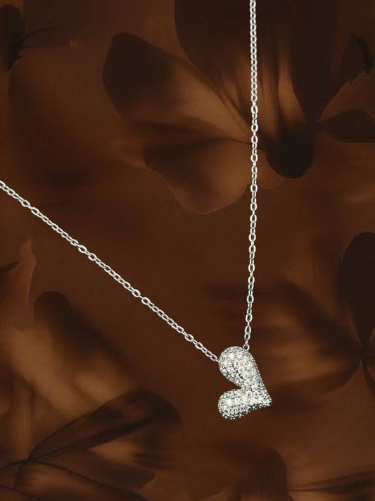 SHE BEAUTY Korean heart pendant necklace featuring a silver-tone chain and a sparkling crystal-encrusted heart charm.
