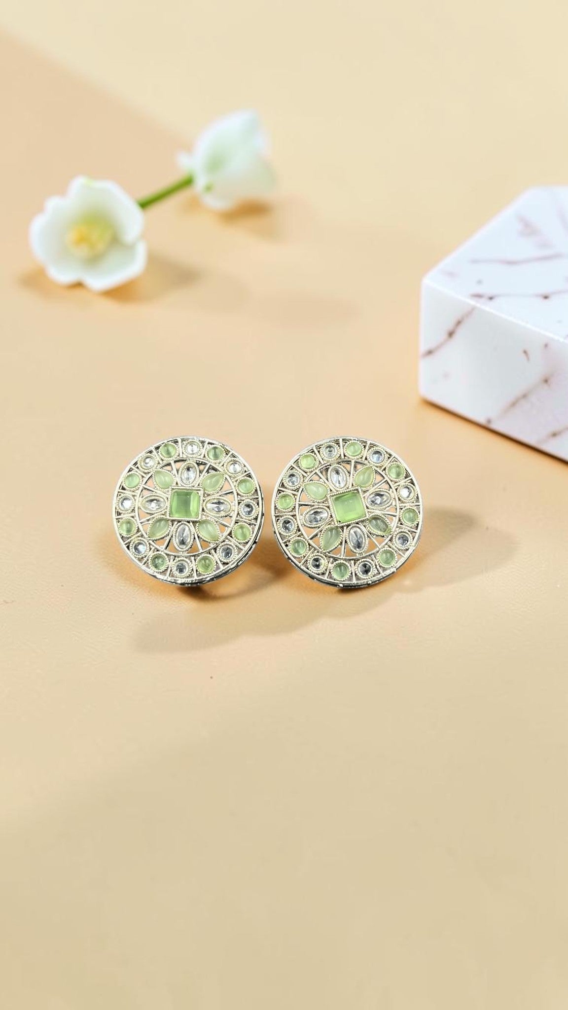 SHE BEAUTY silver circular stud earrings featuring light green stones and intricate metalwork for ethnic outfits