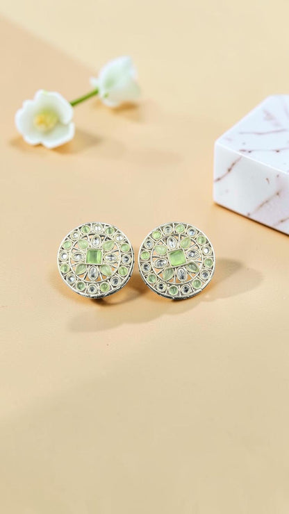 SHE BEAUTY silver circular stud earrings featuring light green stones and intricate metalwork for ethnic outfits