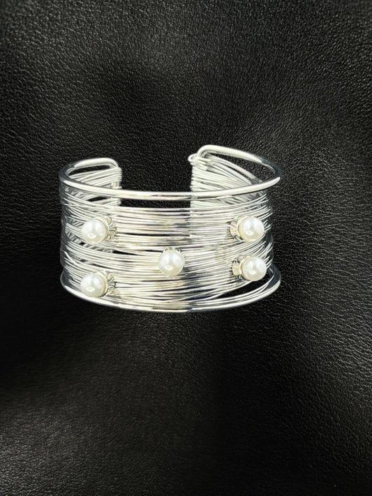 SHE BEAUTY silver multilayer cuff bracelet featuring five white pearls on a textured wire band for elegant style.