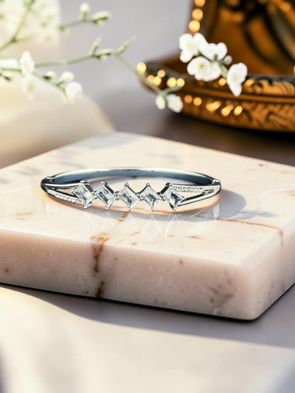 SHE BEAUTY anti-tarnish silver bracelet featuring sparkling marquise-cut zirconia stones on a marble display stand.