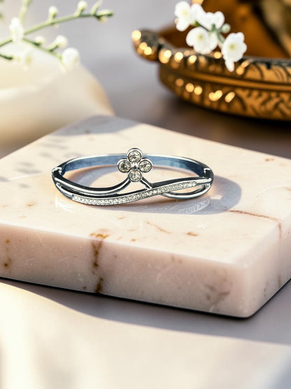 SHE BEAUTY silver-tone zirconia bracelet with a delicate floral motif, featuring an anti-tarnish finish.
