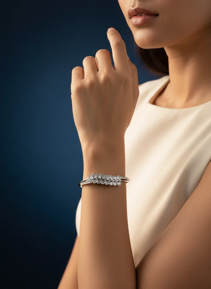 SHE BEAUTY anti-tarnish silver bracelet featuring a delicate leaf-shaped design with sparkling zirconia stones.