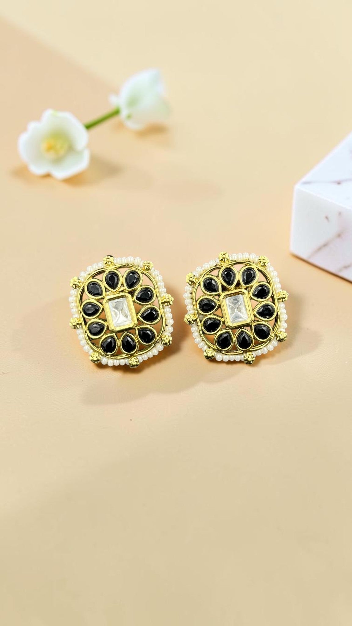 SHE BEAUTY square kundan tops featuring black teardrop stones, a central clear crystal, and delicate pearl detailing.