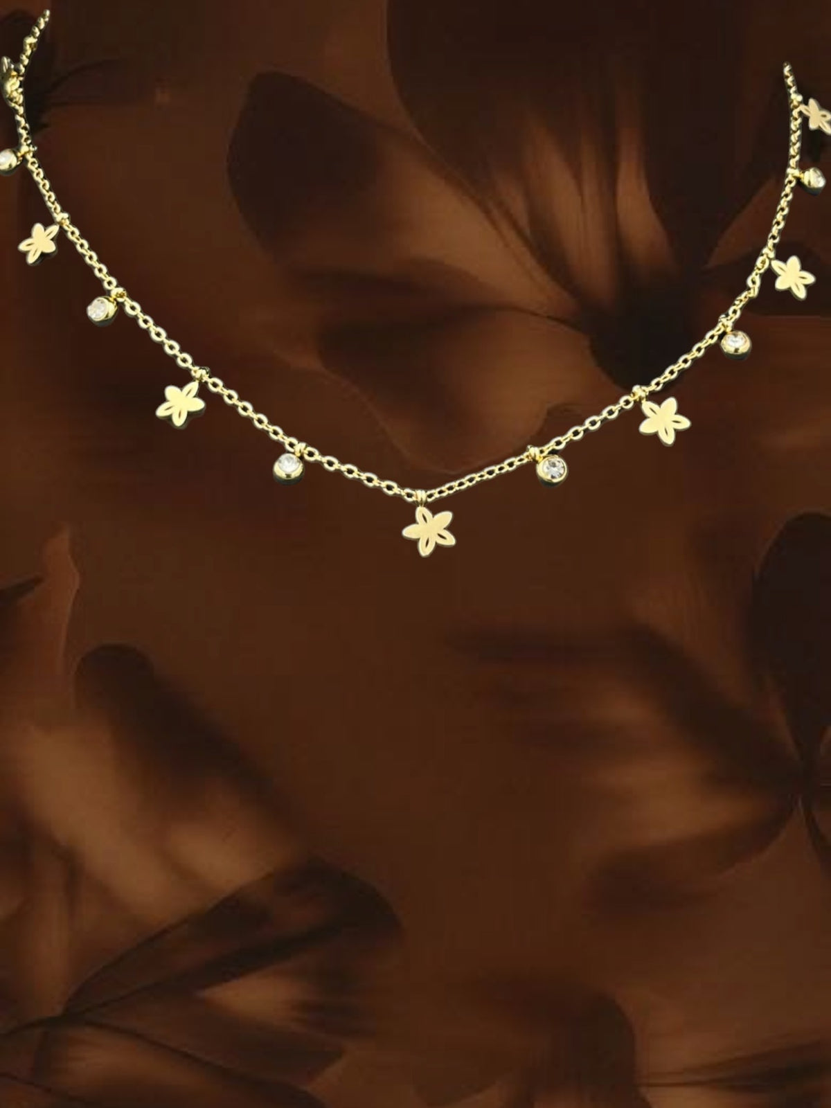 SHE BEAUTY SS Starflower chain necklace featuring delicate gold-tone flower charms and sparkling crystal accents.