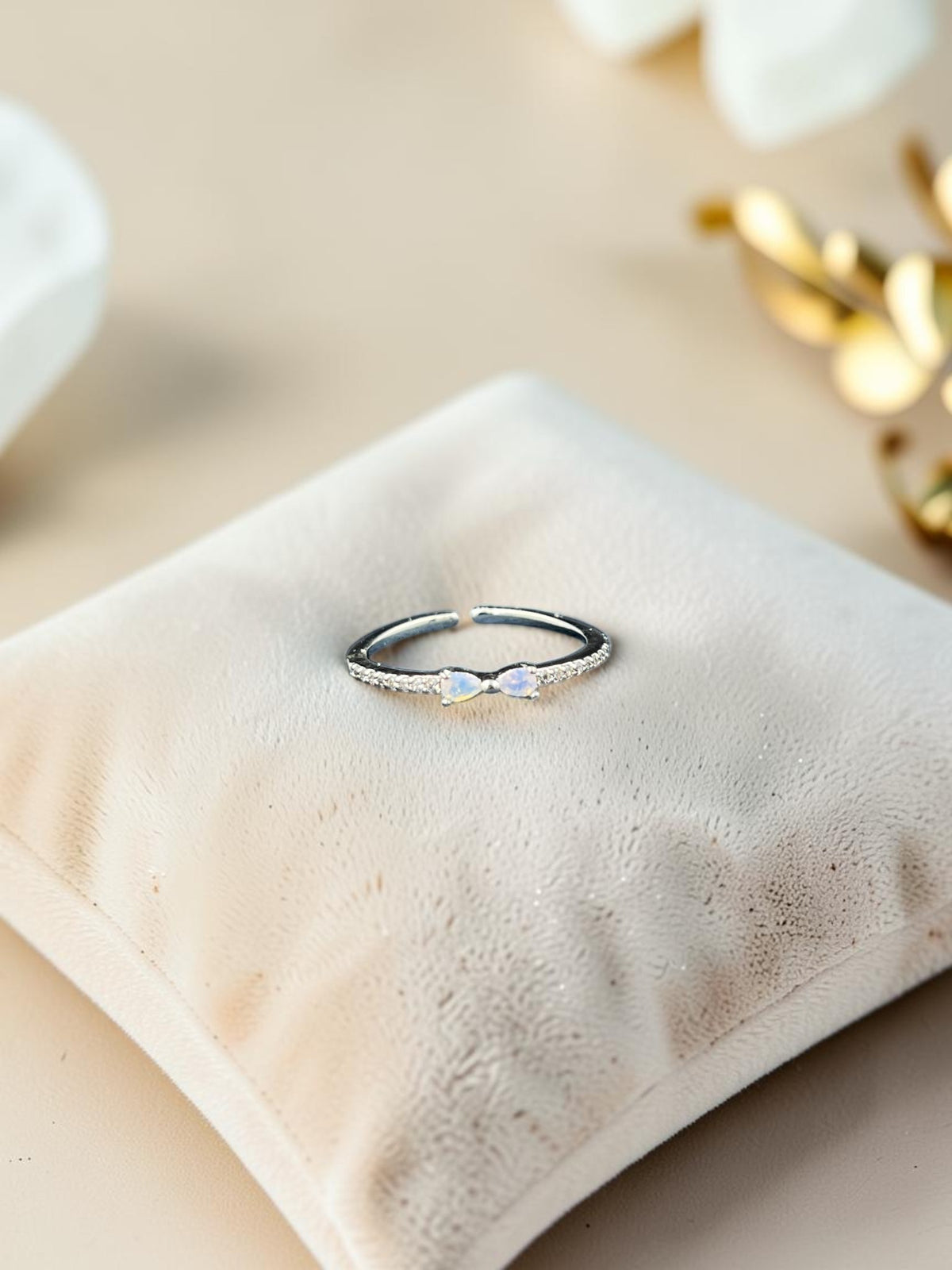 SHE BEAUTY sterling girlish ring with a delicate bow design, sparkling stones, and a polished silver finish.