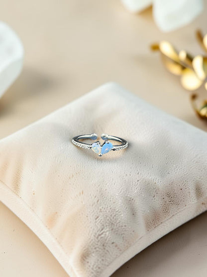 SHE BEAUTY sterling girlish ring featuring a delicate heart-shaped opal stone on a silver band for festive wear.