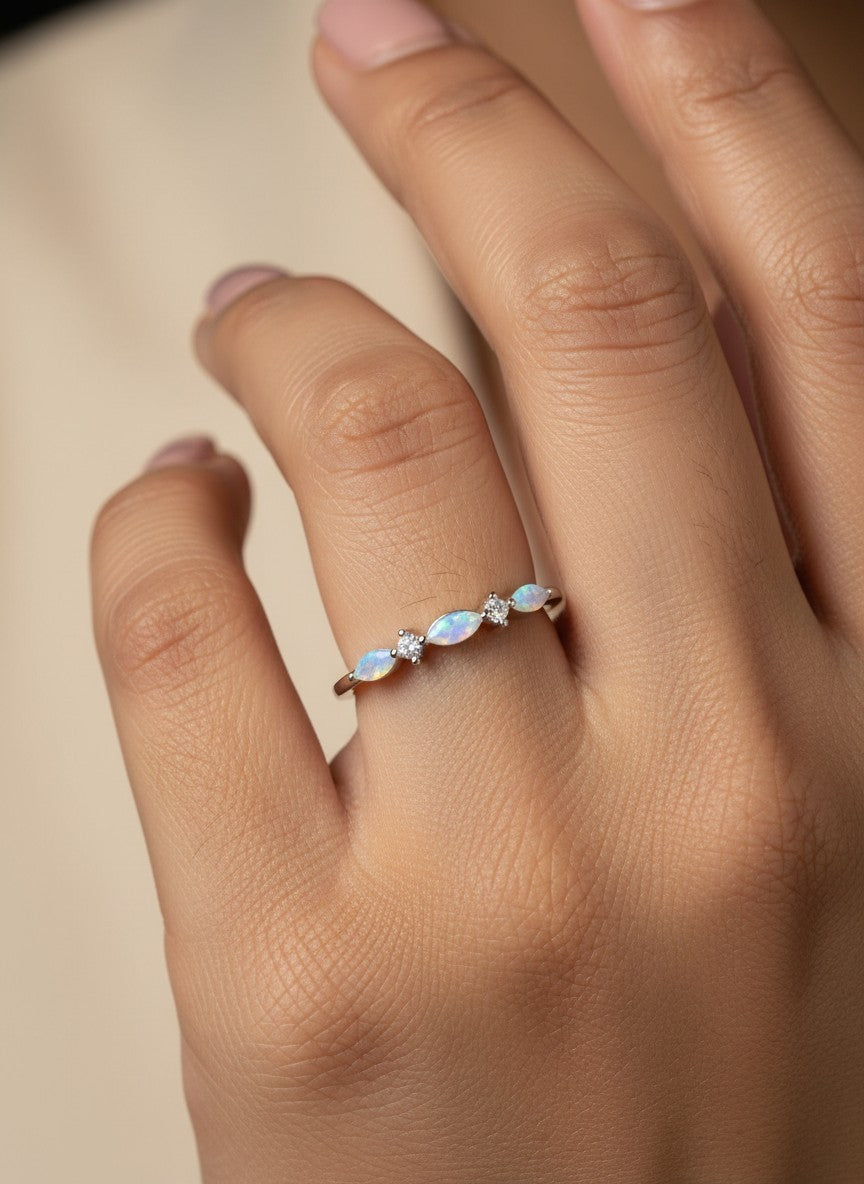 SHE BEAUTY sterling silver ring featuring marquise-cut opals and small round crystals on a delicate band