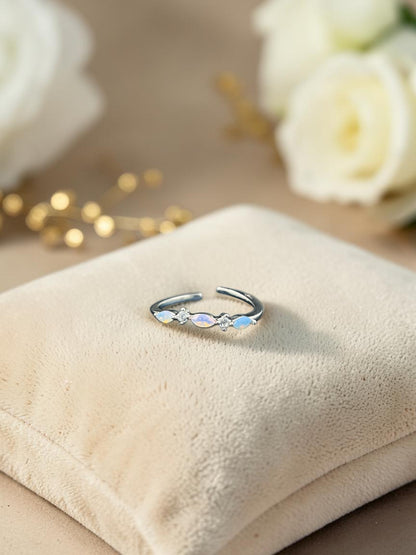 SHE BEAUTY sterling silver girlish ring featuring marquise-cut opal stones and clear crystals on a velvet cushion