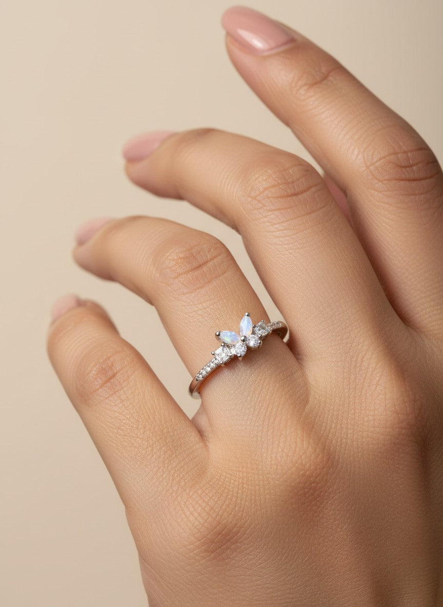 SHE BEAUTY sterling girlish ring with marquise opal and clear stones on a woman's finger for festive party wear