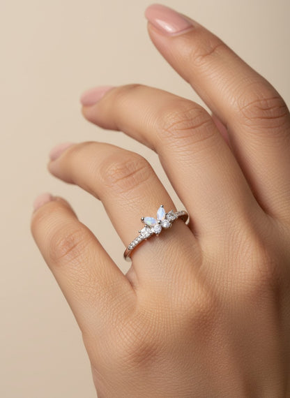 SHE BEAUTY sterling girlish ring with marquise opal and clear stones on a woman's finger for festive party wear