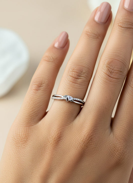 SHE BEAUTY sterling silver girlish ring with a delicate crossover band and sparkling stone detail on a hand