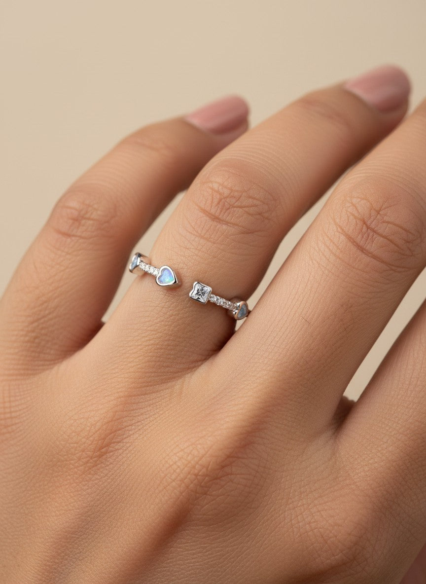 SHE BEAUTY sterling silver open ring featuring heart-shaped opal stones and a central square crystal for party wear.