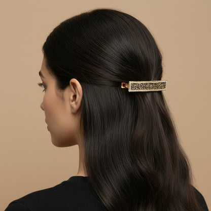 SHE BEAUTY vintage metallic barrette with intricate lace-inspired filigree detail worn in dark hair