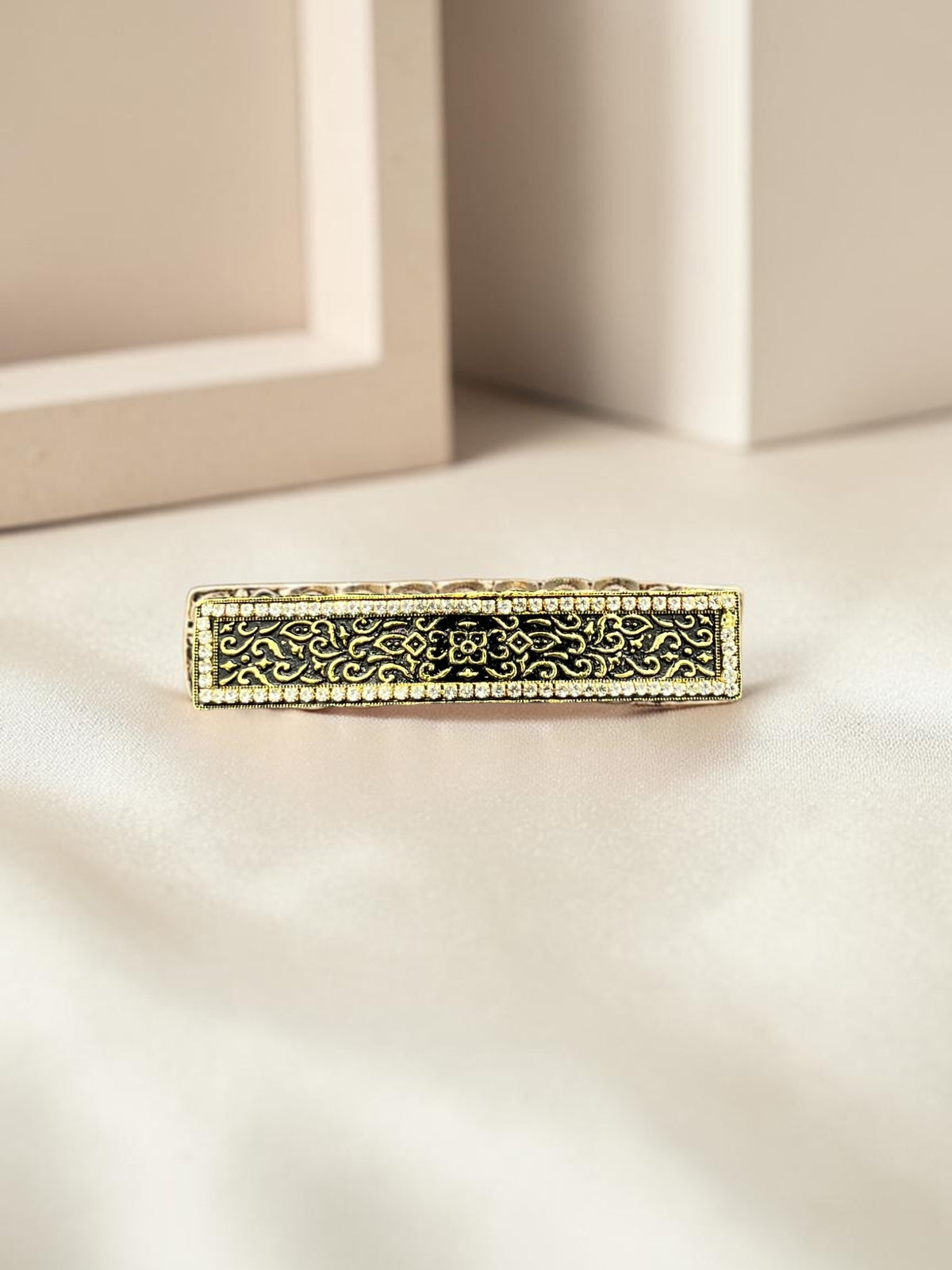 SHE BEAUTY vintage metallic barrette with intricate black lace-inspired filigree and crystal border on satin fabric