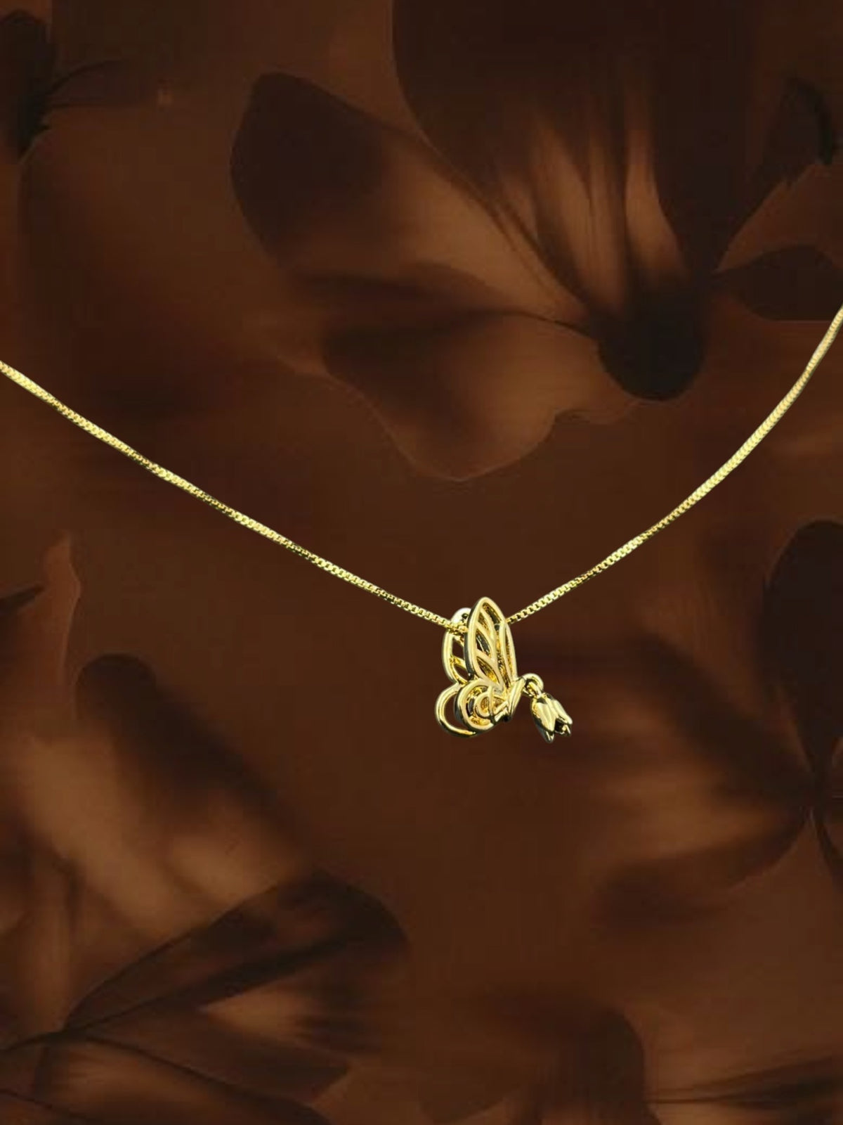 SHE BEAUTY gold-toned winged tulip pendant necklace with a delicate chain for festive and everyday wear.