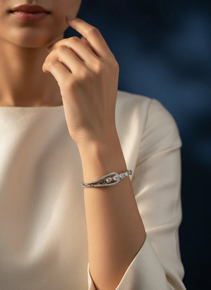 SHE BEAUTY anti-tarnish silver bracelet with sparkling zirconia stones worn on a woman's wrist for a festive look